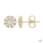 A pair of sparkling round diamond stud earrings with a gold band and smaller round diamonds around the main studs.
